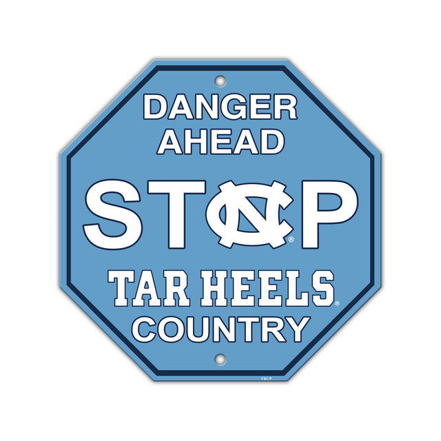 A blue and white North Carolina Tar Heels stop sign with team logo and the text 'DANGER AHEAD
STOP
TAR HEELS
COUNTRY'.