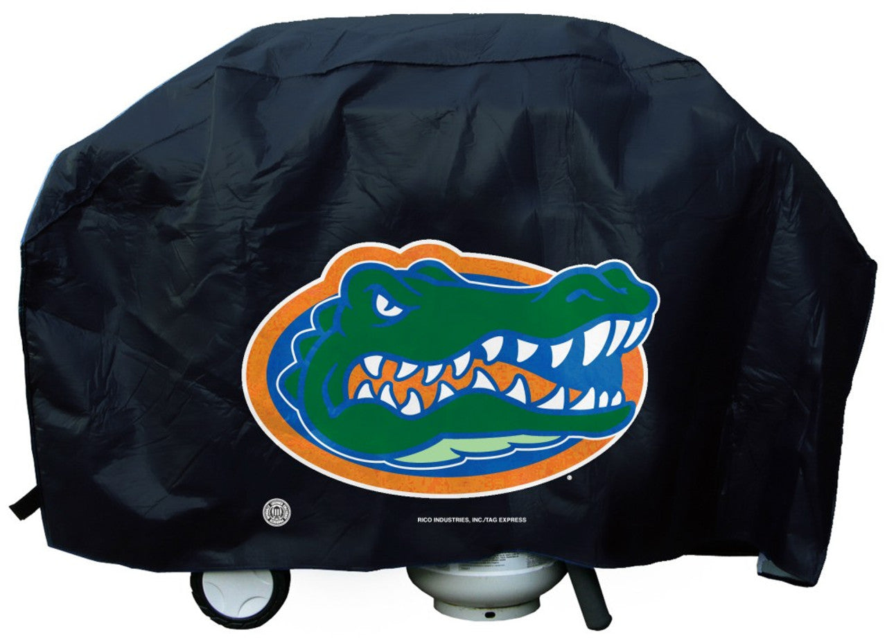 Florida Gators Deluxe Vinyl Grill Cover with secure straps, felt lining, and bold logo. Fits most standard grills.