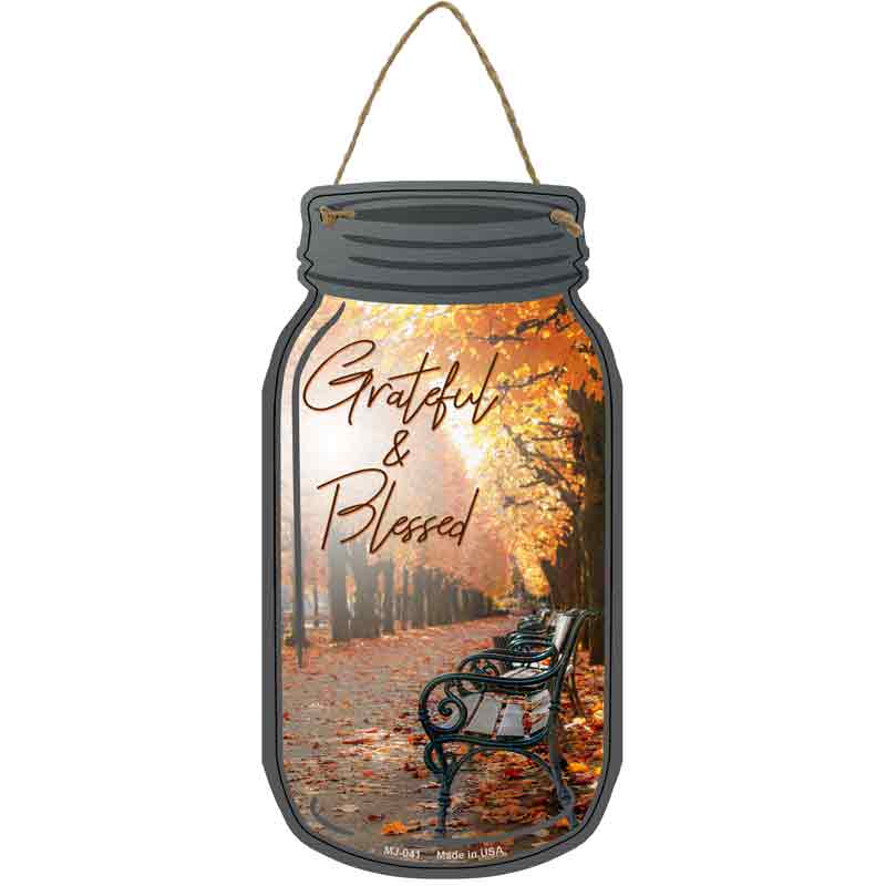 Add a touch of autumn charm with the Fall Grateful And Blessed Novelty Metal Mason Jar Sign. Made in the USA from high-quality aluminum, this 4" x 8" sign features a weather-resistant finish and comes with an 8" string for easy hanging. Perfect for decorating your home, kitchen, office, or porch, it makes a thoughtful seasonal gift or a festive accent for fall gatherings. Durable, lightweight, and charming, this sign celebrates gratitude and the beauty of the autumn season.