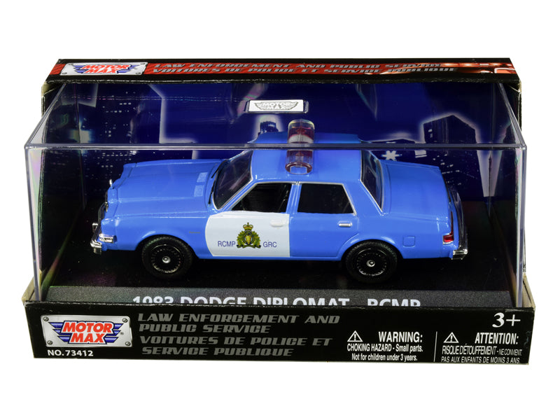Motormax 1983 Dodge Diplomat RCMP 1/43 diecast in light blue and white with display case. Collector police car model.