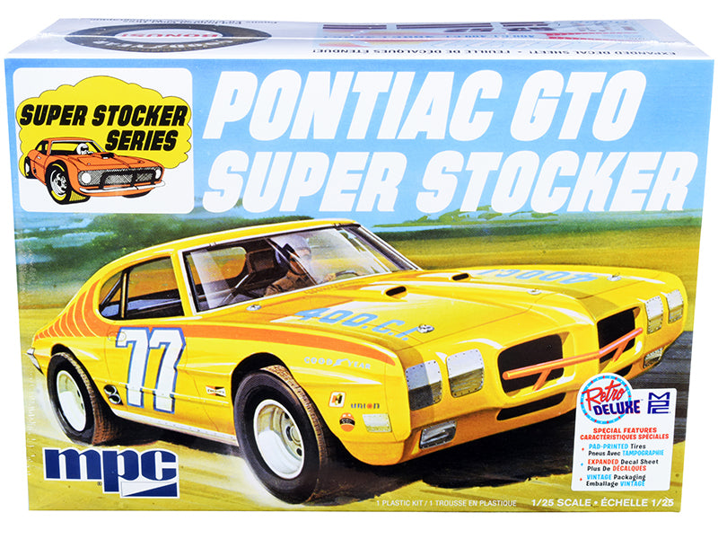 MPC 1970 Pontiac GTO Super Stocker 1/25 scale model kit with racing engine, chrome parts, dirt tires, and decals.