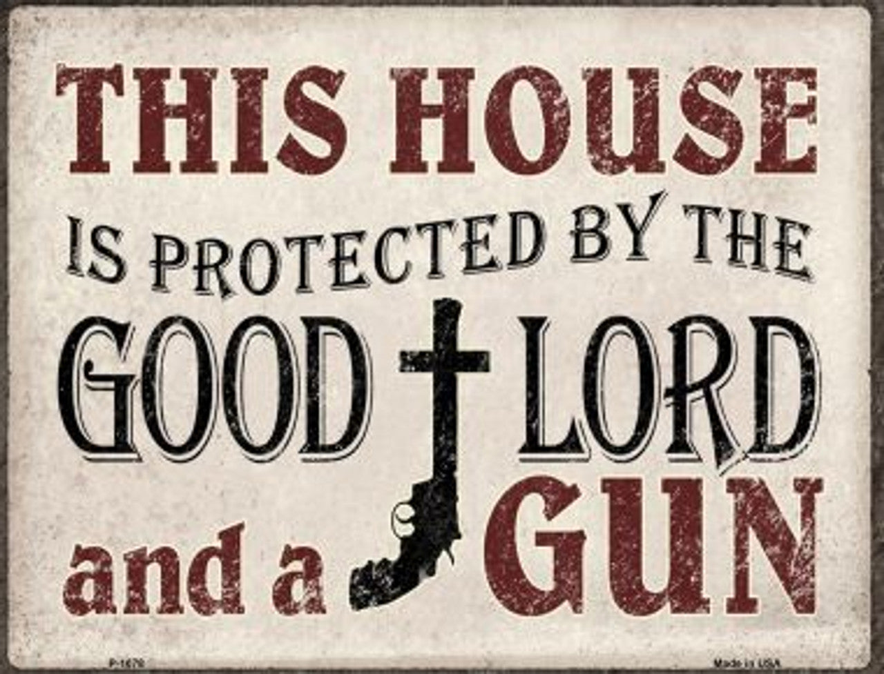 A metal parking sign with a white background featuring the text 'This HOUSE is PROTECTED by the GOOD LORD and a GUN' along with a graphic of a cross.
