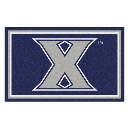 Xavier Musketeers NCAA 4ft. x 6ft. Plush Rug featuring team graphics and colors, 100% nylon face, durable Duragon backing.