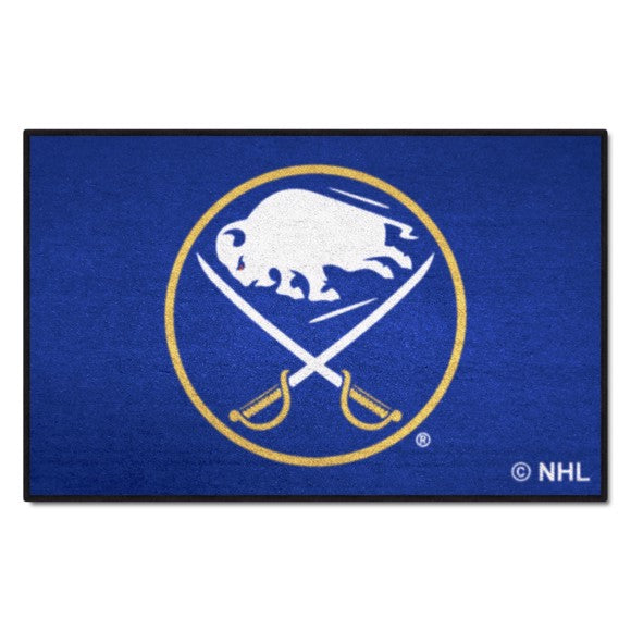 Buffalo Sabres Logo Starter Rug / Mat: 19" x 30", 100% nylon, non-skid backing, machine washable, vibrant team colors, made in USA.