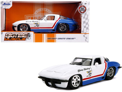Jada 1/24 1963 Chevy Corvette Stingray diecast in white and blue with red stripe, opening hood and detailed engine.