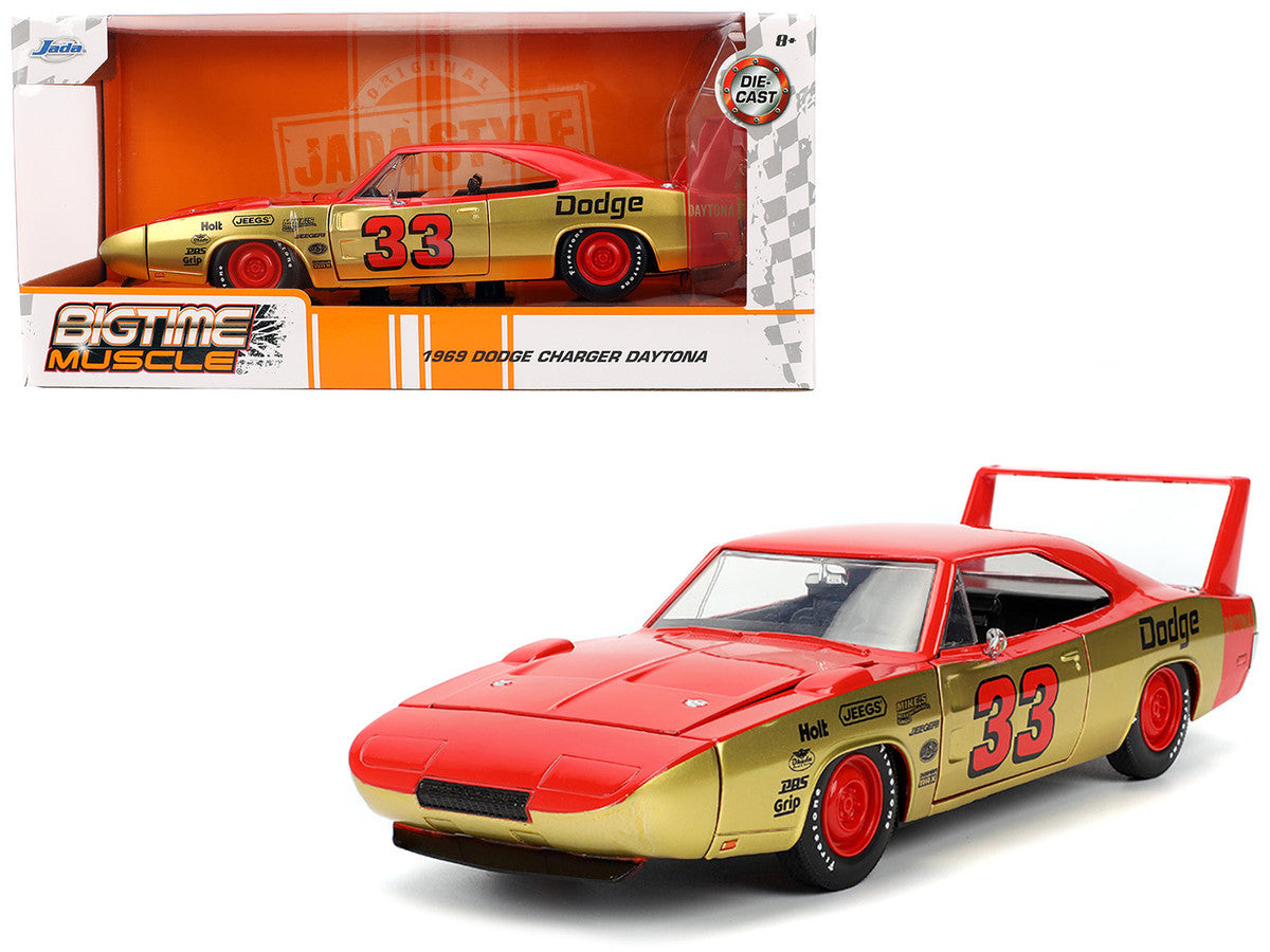 1969 Dodge Charger Daytona model car with gold and red design, featuring the number 33, in front of its packaging.