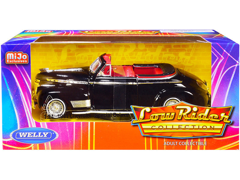 1941 Chevrolet Special Deluxe Convertible Black with Red Interior 1/24 Diecast Model Car by Welly from the Low Rider Collection, featuring opening doors and trunk.