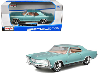 Maisto 1965 Buick Riviera Gran Sport diecast model car in light blue metallic, 1/26 scale with real rubber tires.