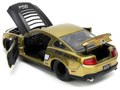 2010 Ford Mustang GT Gold Metallic with Black Graphics and Hood "Tom's Racing" "Bigtime Muscle" Series 1/24 Diecast Model Car by Jada