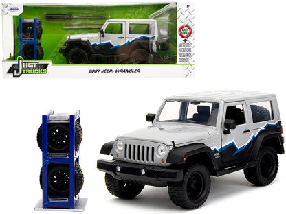2007 Jeep Wrangler 1/24 scale gray and black diecast model by Jada with stripes and extra wheels from Just Trucks series