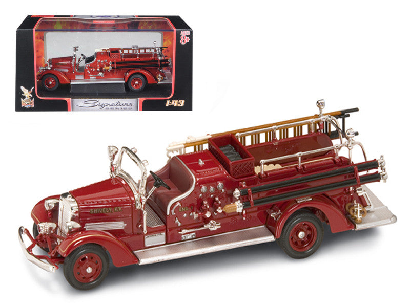 1938 Ahrens Fox VC Fire Engine Red 1/43 Diecast Model by Road Signature, featuring detailed interior and exterior, with real rubber tires, in a plastic display showcase.