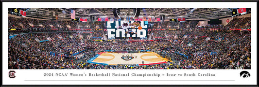 Panoramic of the 2024 NCAA Women's Basketball National Championship Game featuring Iowa Hawkeyes vs. South Carolina Gamecocks with players on the court and fans in the stands.