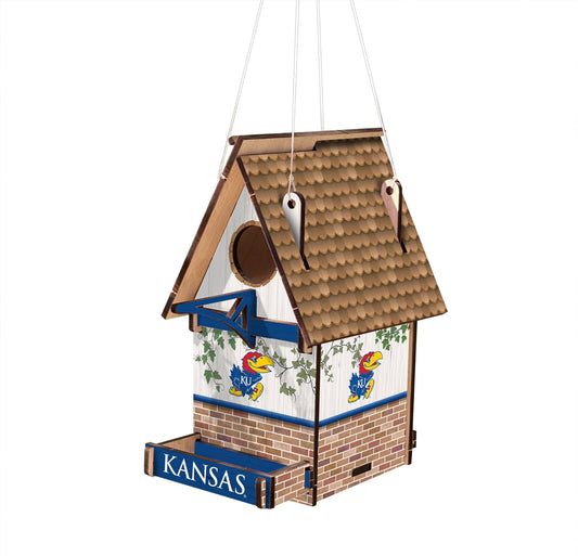 Show your Kansas Jayhawks&nbsp;team spirit and love of birds with this officially licensed Wood Birdhouse. Crafted from MDF, this 15" x 15" birdhouse features vivid team graphics, a roof designed to resemble brown wood shingles, and a white wood design with a brick wall design
