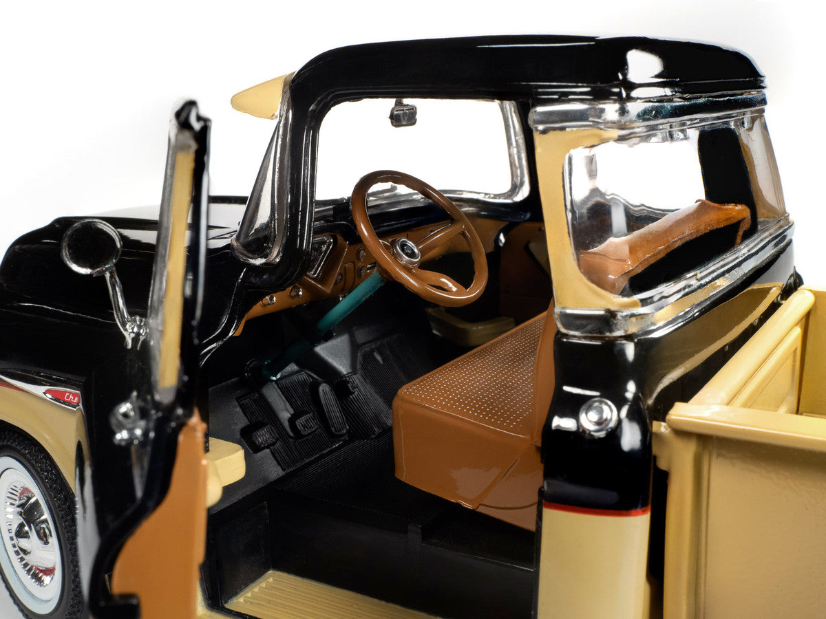 Interior of 1957 Chevrolet 3100 Stepside Pickup Truck, black and tan with Leinenkugle's Beer graphics, 1/18 diecast model.