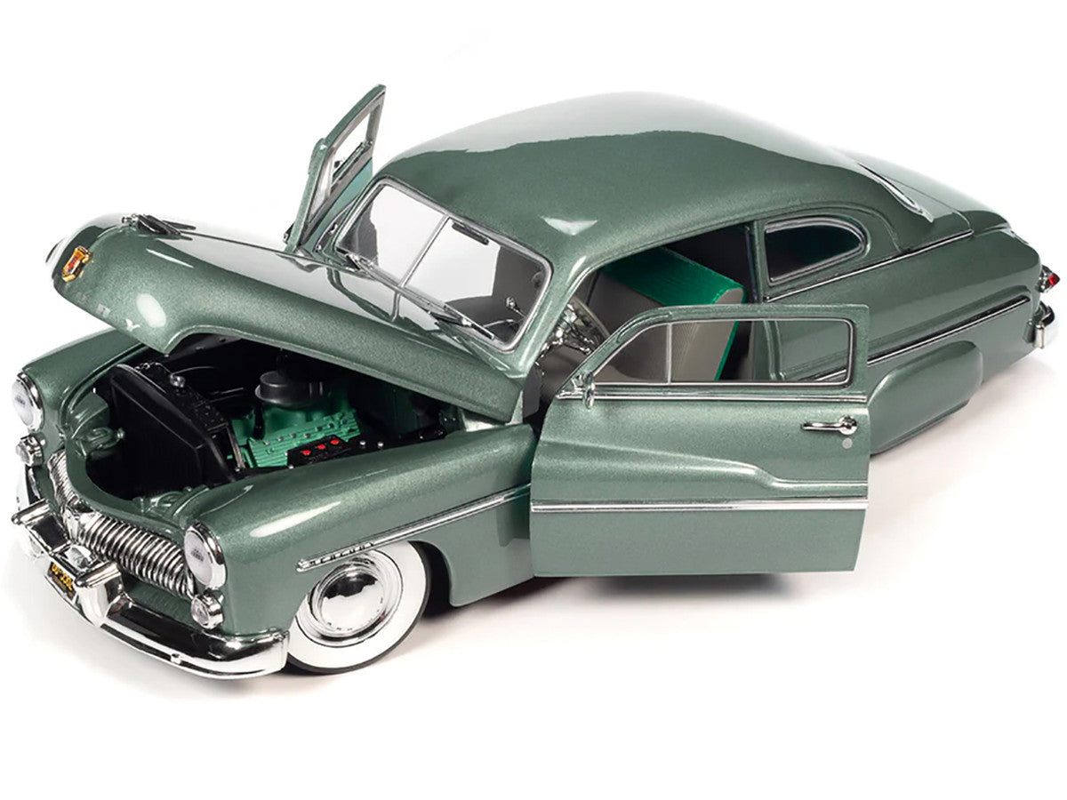 Openings on the Auto World 1949 Mercury Eight Coupe 1/18 diecast. Brand new, limited edition, with real rubber tires, detailed interior, and officially licensed.