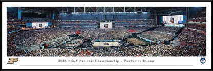 Panoramic of the 2024 NCAA Basketball National Championship Game featuring UConn Huskies vs. Purdue Boilermakers with players on the court and fans in the stands.