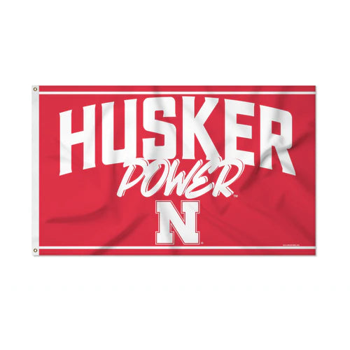Nebraska Cornhuskers Script Banner Flag: Vibrant 3' x 5' design with FREE shipping. Official NCAA by Rico.