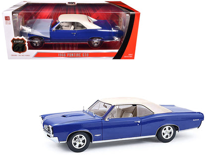 Highway 61 1966 Pontiac GTO Barrier Blue 1:18 diecast model car with white top, opening parts, and detailed design.