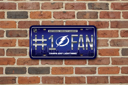 Tampa Bay Lightning license plate with '#1 Fan' text and logo on a brick wall