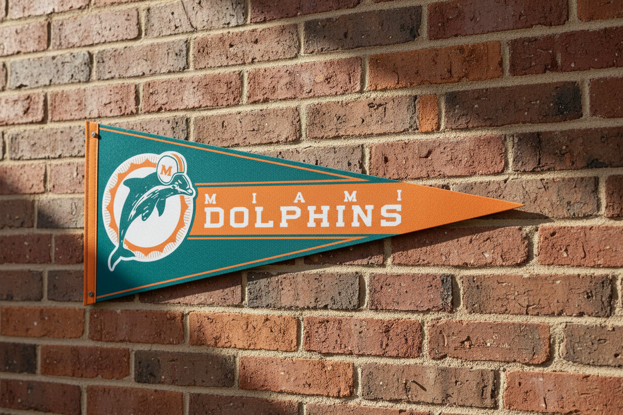 Miami Dolphins 12x30-inch retro NFL felt pennant on a brick wall