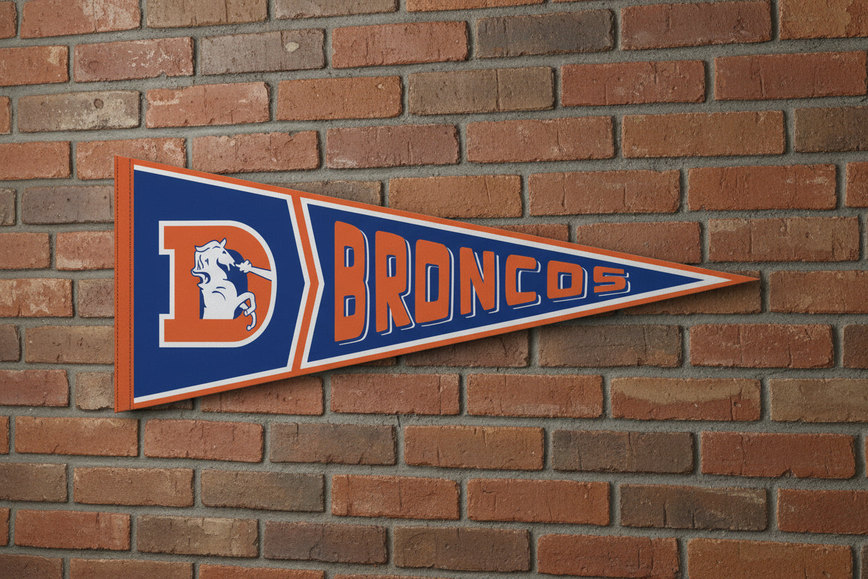 Denver Broncos pennant with blue and orange colors on a brick wall