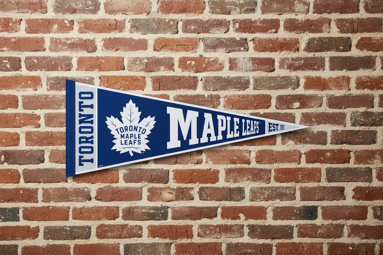 Toronto Maple Leafs pennant with blue and white colors on a brick wall