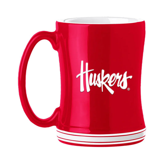 Nebraska Cornhuskers 14 oz ceramic coffee mug with 3D logo, team colors, and team name on handle. Microwave & dishwasher safe.