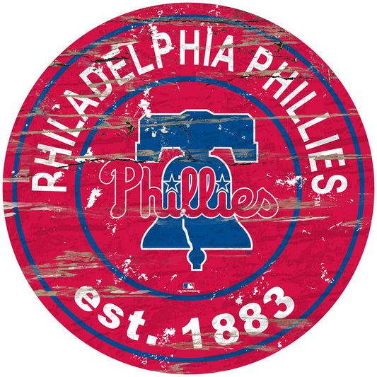 Philadelphia Phillies distressed round sign, 24" diameter. Features team graphics & established date. Indoor use only. Officially licensed.