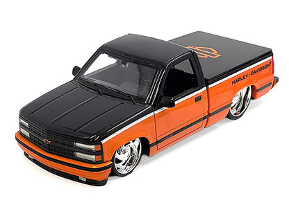 Model of an orange and black Harley Davidson truck
