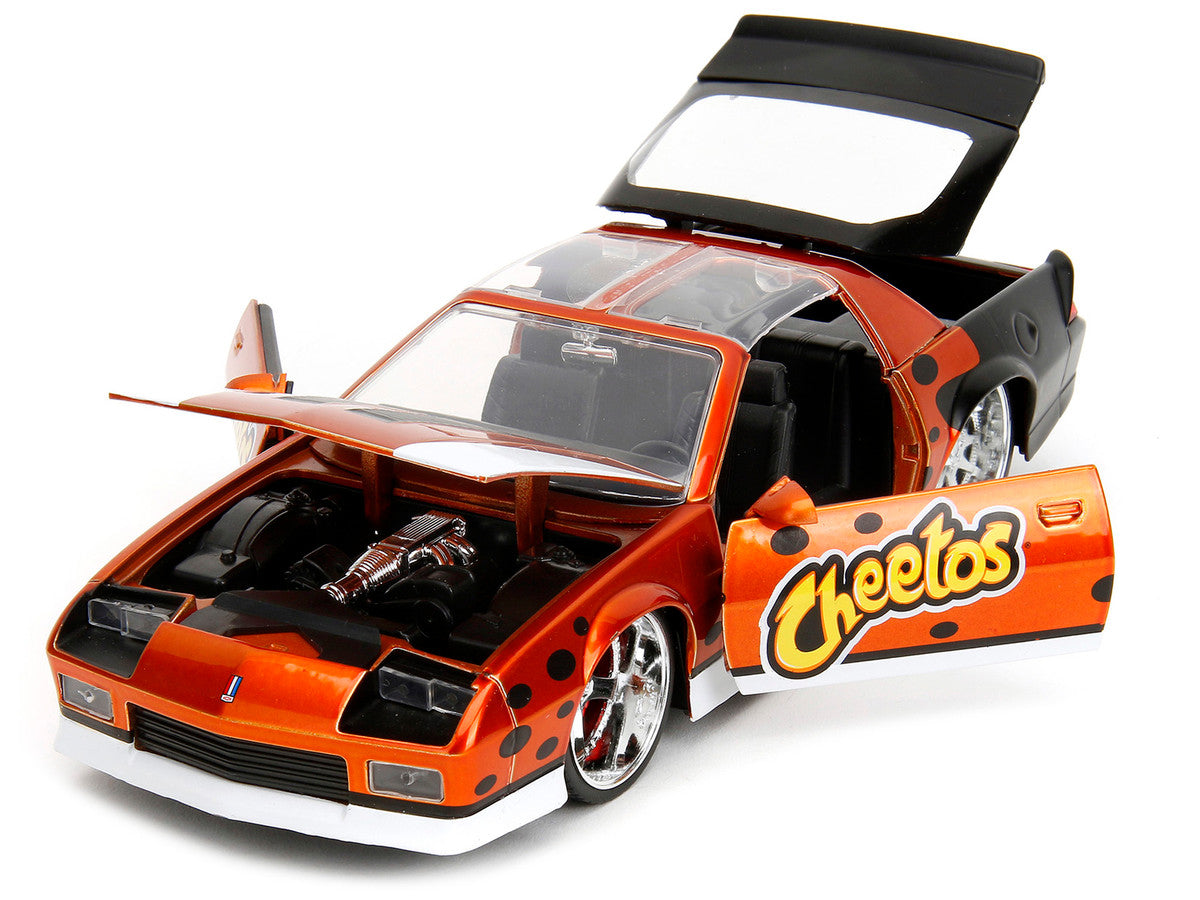 1985 Chevrolet Camaro Z/28 Orange Metallic w/ Graphics and Chester Cheetah Diecast Figure "Cheetos" "Hollywood Rides" Series 1/24 Diecast Car by Jada