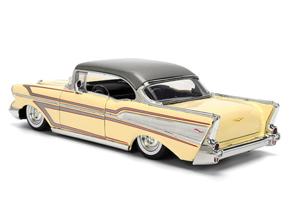 Model of a classic car with a yellow body and silver roof 