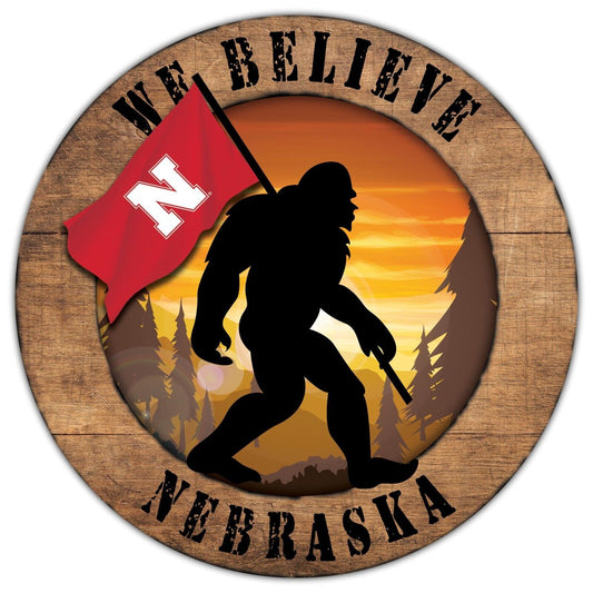 Nebraska Cornhuskers We Believe Big Foot 12" Round Wooden Sign by Fan Creations