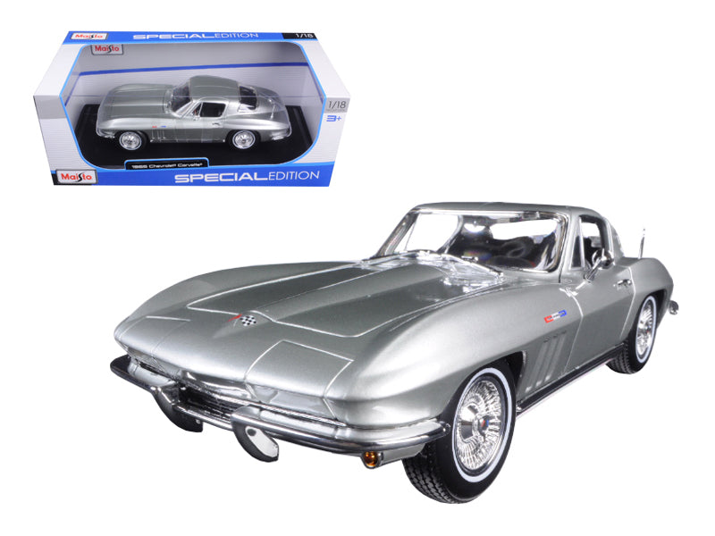 Maisto 1965 Chevrolet Corvette diecast model car in silver, 1/18 scale with detailed features, steerable wheels, and opening parts.