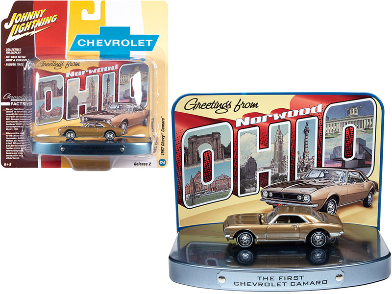 Johnny Lightning 1967 Chevrolet Camaro diecast car, gold with collectible tin display, 1/64 scale, features detailed exterior and opening hood.