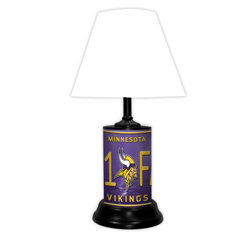 Minnesota Vikings tabletop lamp featuring team colors, logo and wording "#1 Fan" with black base and white shade