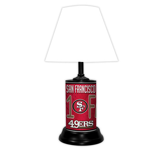 San Francisco 49ers tabletop lamp featuring team colors, logo and wording "#1 Fan" with black base and white shade